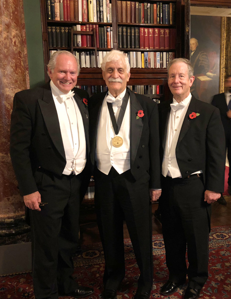 ProfessorRaymond Damadian, M.D. at Brooks's in London, England, wearing the Excellence in Medicine medal awarded him by the Chiari and Syringomyelia Foundation. Standing with him is Professor Fraser Henderson, M.D. (left) and Daniel Culver, Fonar Corporation Director of Communications (right).