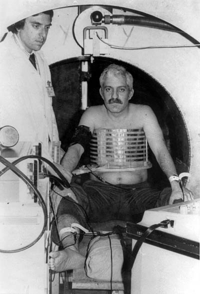 Figure 17. The unsuccessful first human MRI scan of Damadian. Goldsmith concluded that Damadian was simply too fat for his NMR receiver coil (the multi-conductor helix around Damadian's chest).